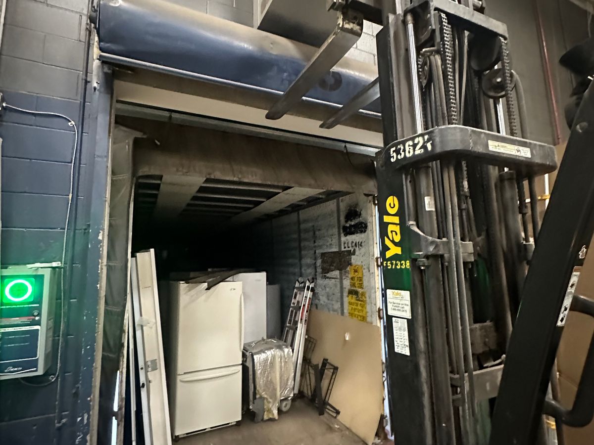 Raynor ControlHoist commercial opener being serviced on work van — MA